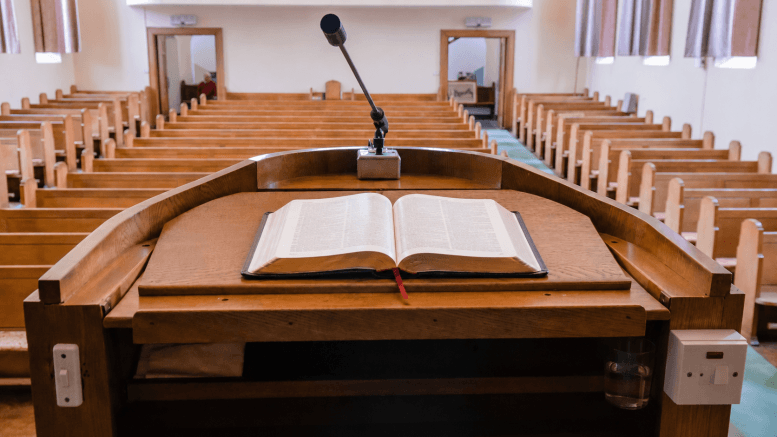 An open Bible on a pulpit — the most political book on earth